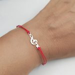 Narukvica crveni konac i srebrna nota 294 N 130000